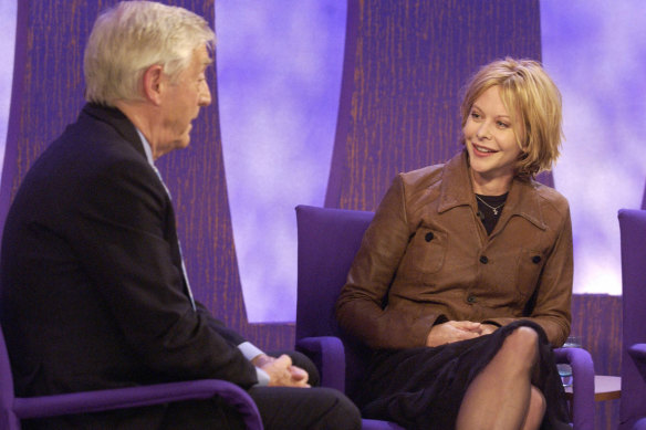 Michael Parkinson and actor Meg Ryan on the set of “Parkinson” in 2002.