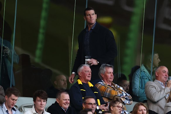 Ben Roberts-Smith (standing) in the crowd during Sunday’s game between Richmond and Adelaide at the MCG.
