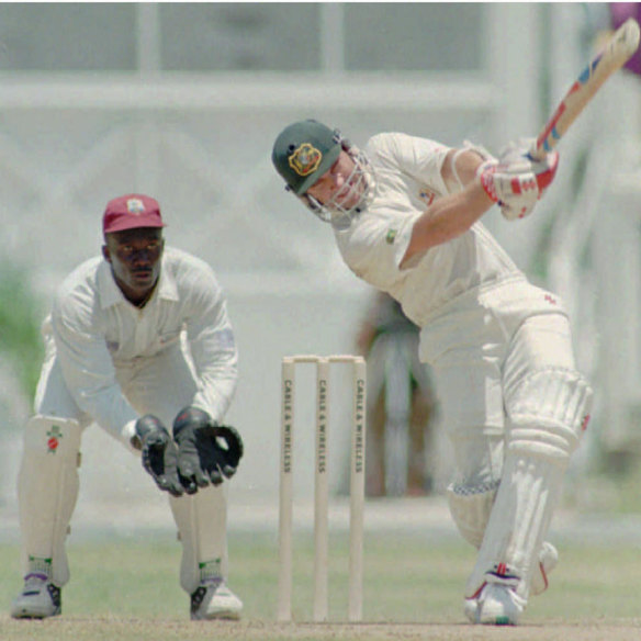 Slater hits Carl Hooper for six as Junior Murray looks on during the second Test against West Indies in Antigua in 1995.