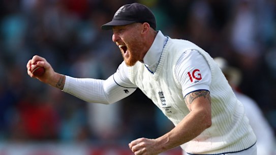 England’s Ben Stokes celebrates after taking a catch to dismiss Australia’s Pat Cummins.