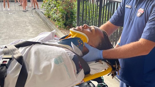 Dominic Young is taken to hospital by ambulance after Saturday’s game.