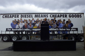 John Howard on the campaign trail in 1998 promising cheaper diesel prices.