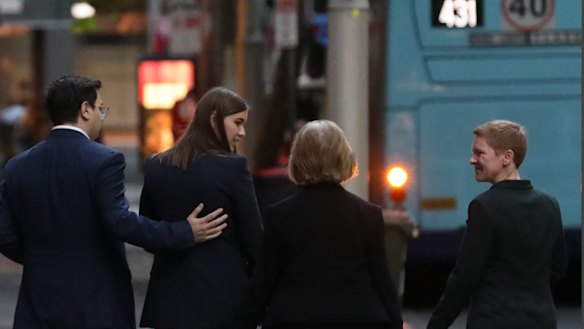 Former Political Staffer Brittany Higgins, accompanied by partner David Sharaz (second left) leaves after speaking to the media after meeting with Prime Minister Scott Morrison at the CPO in Sydney on April 30, 2021.