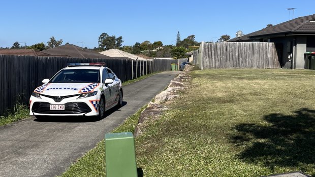 A police car parked at the Goodna home of Sant.