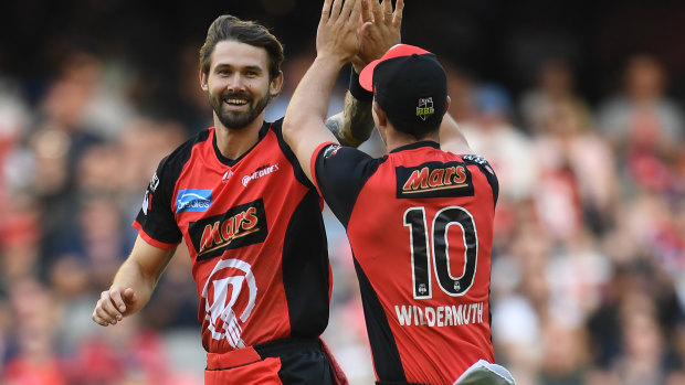 Kane Richardson of the Renegades, left, reacts after dismissing Alex Doolan of the Hurricanes.