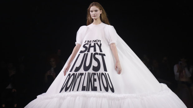 A model wears a gown with the slogan "I'm not shy I just don't like you" at the Viktor & Rolf show at Paris Couture Week.