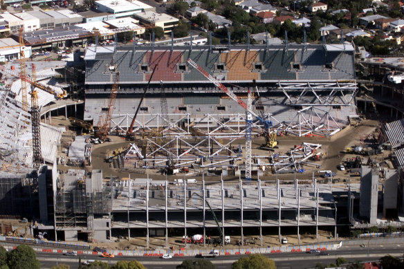 Suncorp Stadium under construction in 2002, with the existing western stand at the rear.