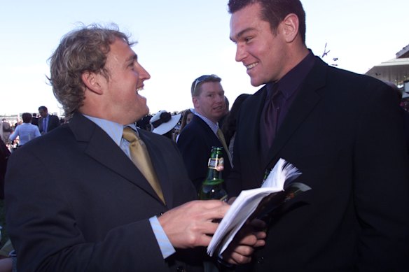 Former Dragons teammates Nathan Brown and Jason Ryles enjoy a beer and punt at Randwick in 2002. The pair are now reunited as coaches at Parramatta.