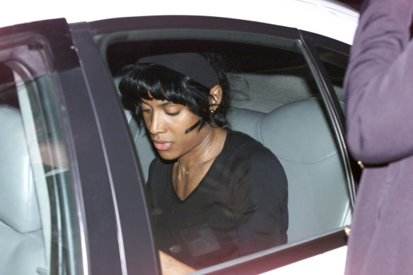 Marie-Jose Perec leaves Sydney in a taxi prior to her scheduled race.