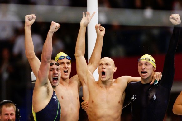 Ashley Callus, Chris Fydler, Michael Klim and Ian Thorpe celebrate their gold in the 4x100m relay at Sydney 2000. The Australians set a world record of 3:13.67 while Klim also broke the individual world record, finishing his leg in 48.18s. 