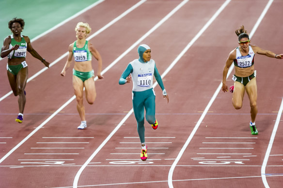 As Cathy Freeman hit the line, in this image, there was not the usual joy and celebration, but more an expression of relief or exhaustion.