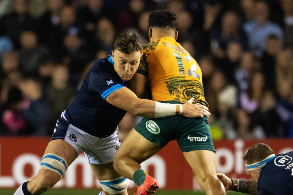 Jack Dempsey tackling Hunter Paisami during the November international at Murrayfield.