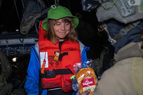 An image released by Israel’s Foreign Ministry shows Greta Thunberg being given a sandwich after her boat was intercepted off Gaza.