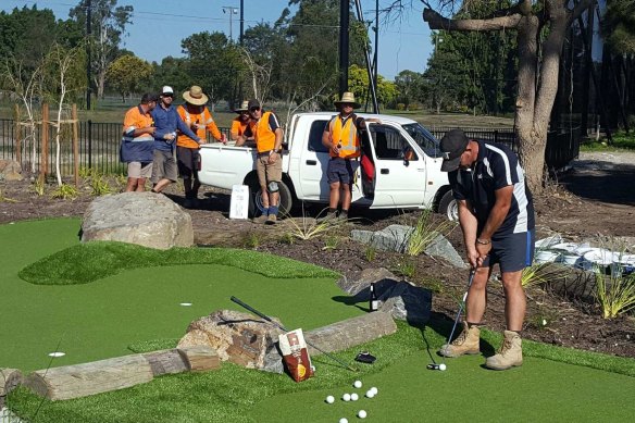 Geoff Bennell tests out one of his mini-golf courses mid-construction.