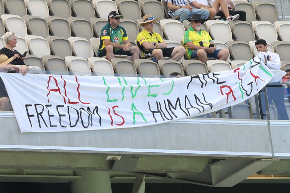 A pro-Palestine banner is removed by security in Perth
