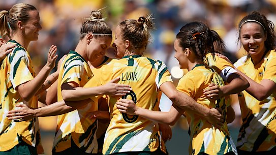 The Matildas celebrate a goal against Chile.