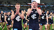 Patrick Cripps and Marc Pittonet lead the resurgent Blues off the ground on Saturday.