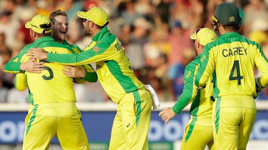 Top two beckons: The Australians celebrate the wicket of New Zealand's Colin de Grandhomme at Lord's.