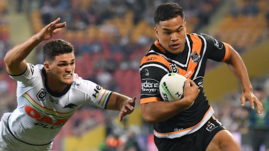 Blown away: Esarn Masters gets around Nathan Cleary to score in the corner.