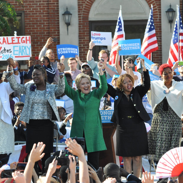 Hillary Clinton on the campaign trail in 2016 with mothers of children killed by gun or police violence. Lucy McBath is to the right of Clinton.