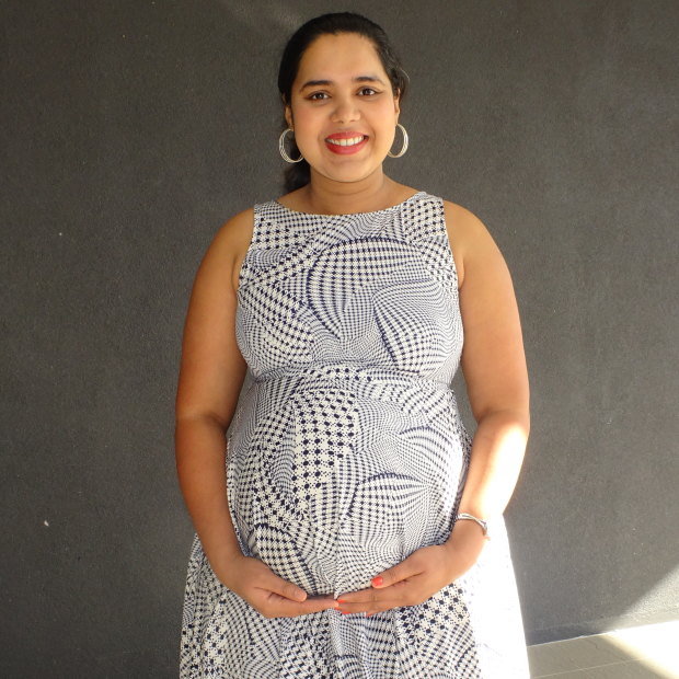 Ashwitha D'Souza standing outside her apartment building the day before she gave birth. 