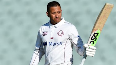Usman Khawaja celebrates his 150-run milestone in Queensland’s Shield game against South Australia.