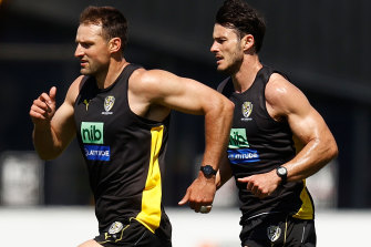 Toby Nankervis and Robbie Tarrant run laps.