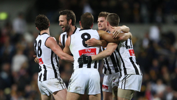 The Magpies celebrate their extra-time victory over the Eagles in 2007.