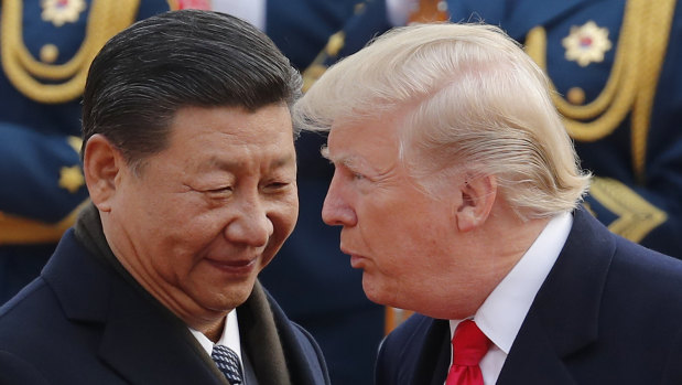 Presidents Xi Jinping and Donald Trump in Beijing last year. China has hit back at the US over trade tariffs.