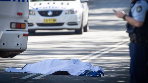 Jett McKee's body covered with a sheet on the street in Forest Lodge. 