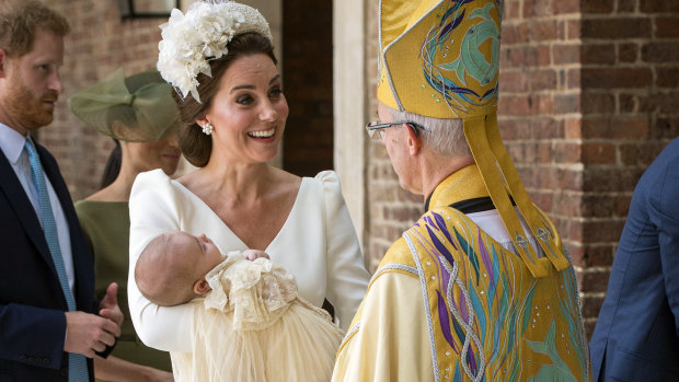 Kate, Duchess of Cambridge, speaks to Archbishop of Canterbury Justin Welby as she arrives carrying Prince Louis for his christening service at the Chapel Royal on Monday.