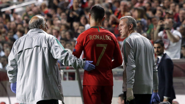 Cristiano Ronaldo leaves the pitch injured.