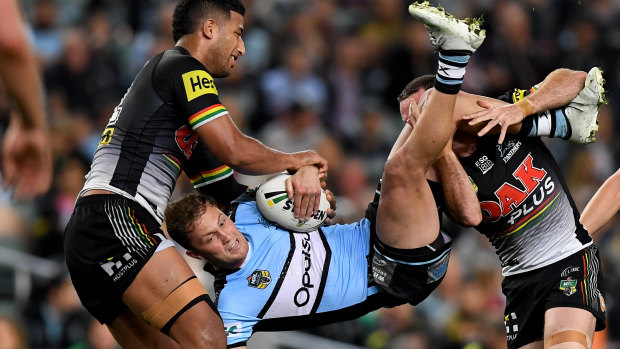 Upended: James Maloney helps Viliame Kikau pick up Matt Moylan, but the Sharks five-eighth had an emphatic win in their personal duel.