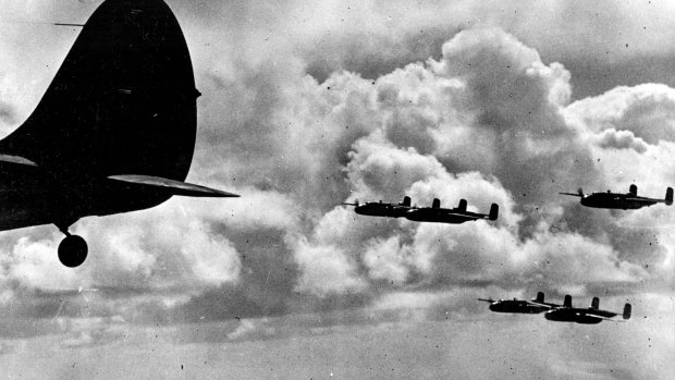 A formation of B-25 Mitchell bombers, flown by US Army Air Corps crews on their way to attack enemy positions.