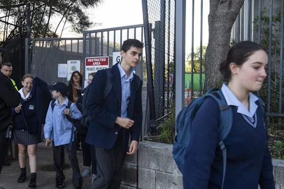 Students leave Moriah War Memorial College after a COVID-19 case is detected.