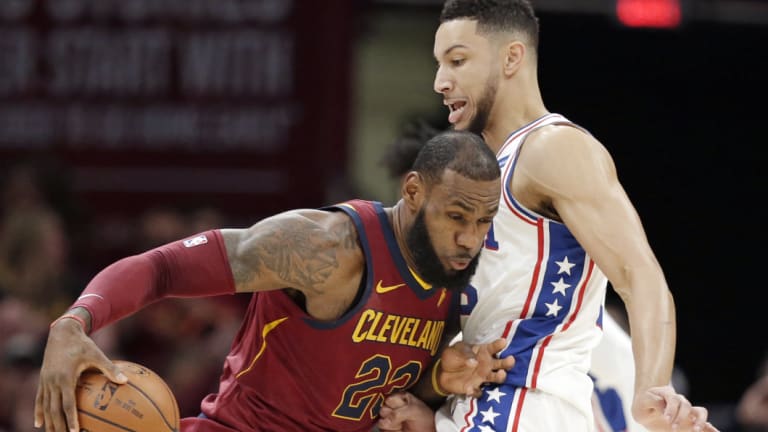 LeBron James and Ben Simmons in NBA action. 