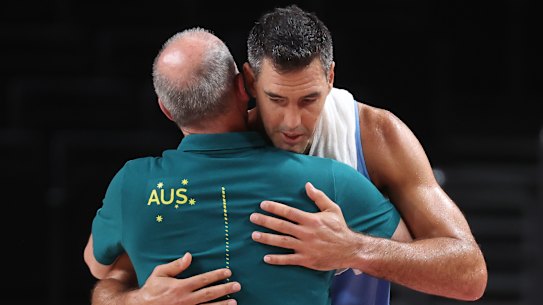 Luis Scola hugs the Boomers’ head coach Brian Goorjian after the match.
