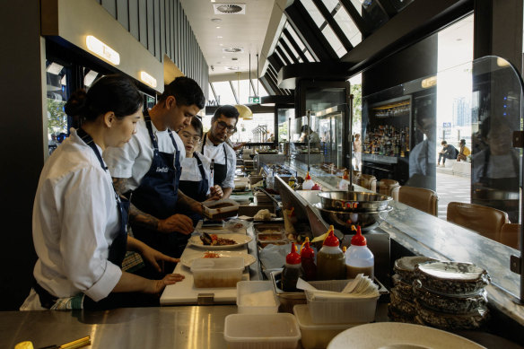 The venue features a lengthy bar for counter dining and drinking.