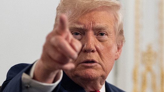 President Donald Trump speaks to reporters after addressing troops via video from Mar-a-Lago.
