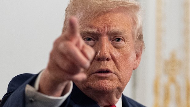 President Donald Trump speaks to reporters after addressing troops via video from the Mar-a-Lago.
