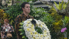 Assistant Foreign Minister Tim Watts lays a wreath at the commemoration ceremony in Bali on Wednesday. 