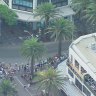 Onlookers after the mysterious explosion in Surfers Paradise.