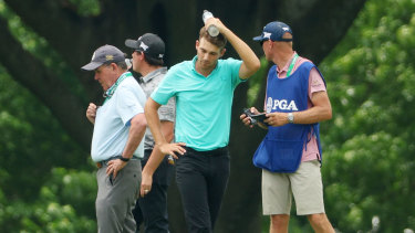 American Aaron Wise after he was struck in the head by a Cameron Smith tee shot.