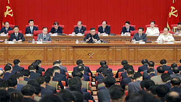 Kim, centre, warned about possible food shortages and called for his people to brace for extended COVID-19 restrictions.