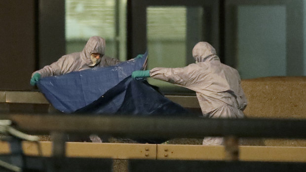 Police forensic officers work where the attacker was killed on London Bridge following Friday's incident.