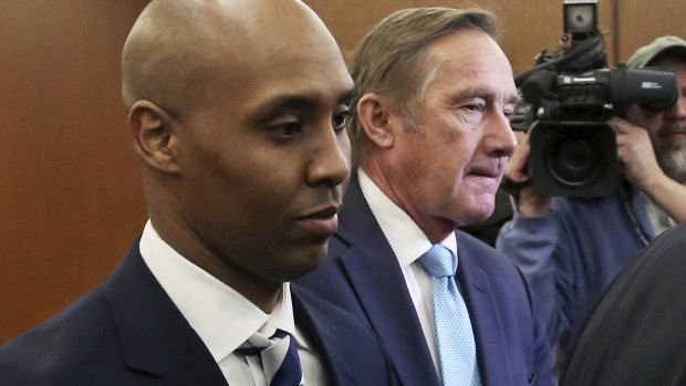Mohamed Noor, left, former Minneapolis police officer, leaves the Hennepin County Government Centre in Minneapolis with attorney Peter Wold in March. 