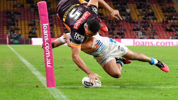 Xavier Coates goes over the line for a try that was later disallowed during the round 7 NRL match between the Brisbane Broncos and the Gold Coast Titans.