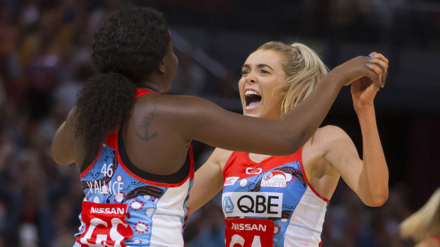 Helen Housby and Sam Wallace celebrate the Swifts comeback win on Sunday over the Giants. 