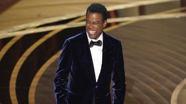 A rare photo of the last time Chris Rock was pictured smiling.