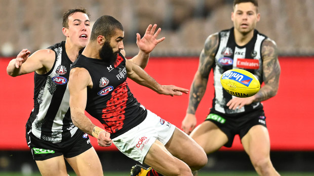 Essendon's Adam Saad under pressure.